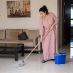 A women is doing Home Cleaning in Kuwait